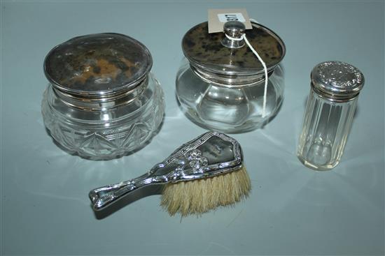 Childs silver back hand brush, a silver topped jar, a silver and tortoiseshell lidded powder box and another similar(-)